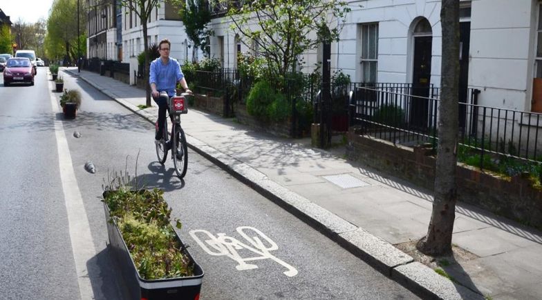 A man riding in a London cycle lane